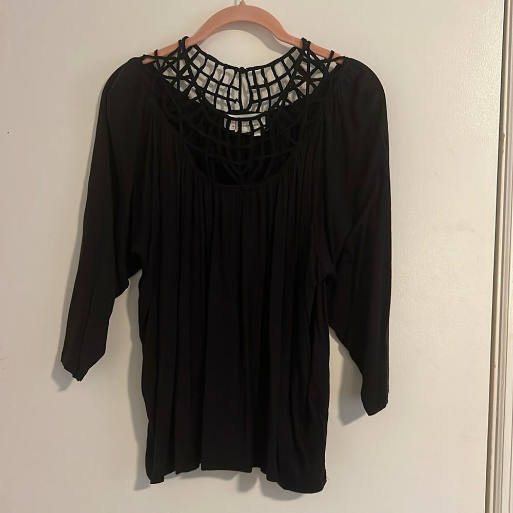 Anthropologie black blouse with decorative detail around neck. Large